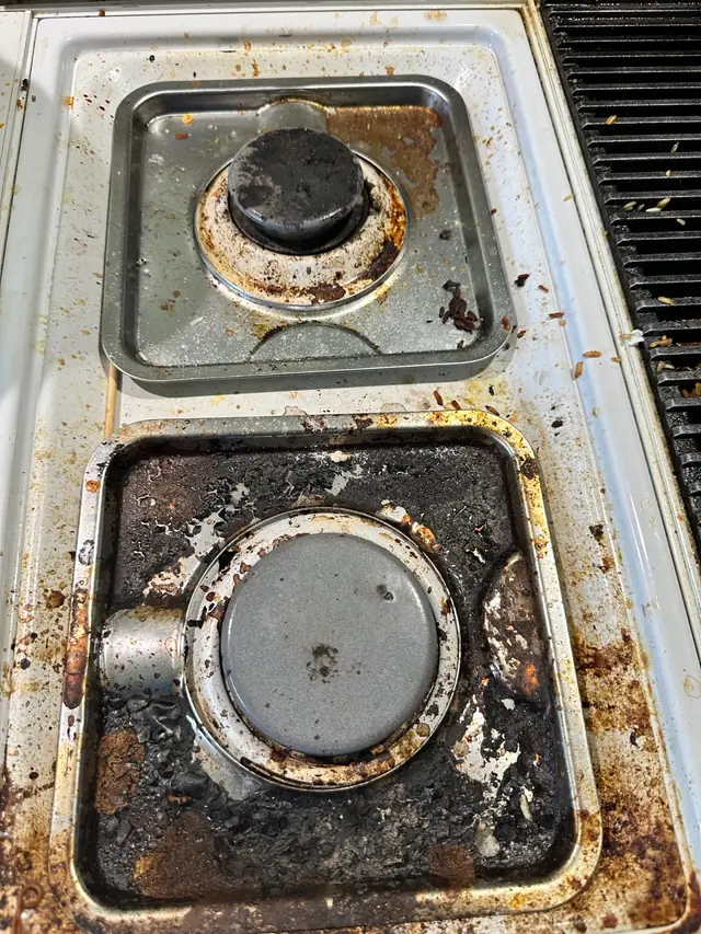 Before: a gas stovetop crusted with burnt-on grease